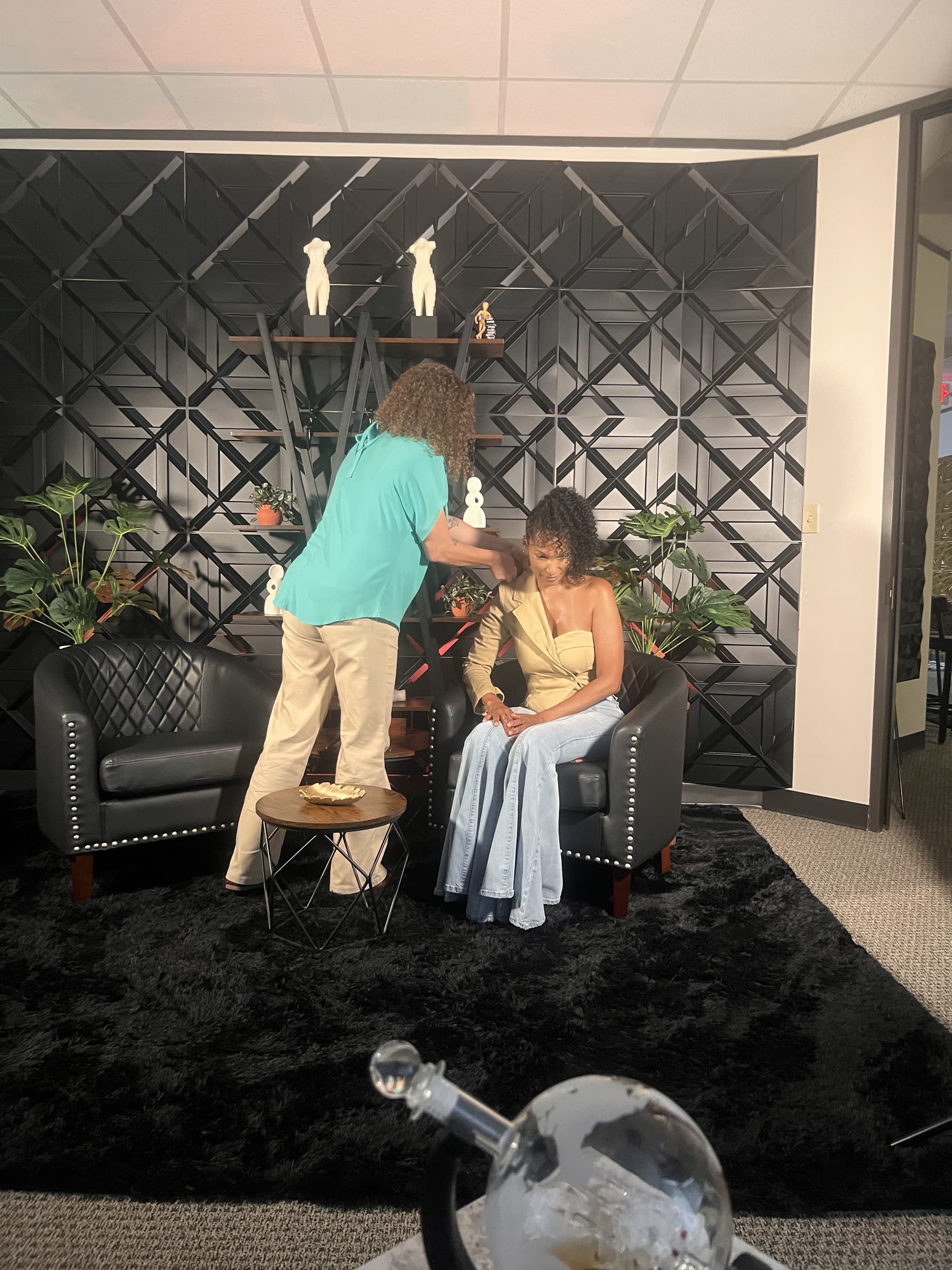 Makeup touch-up before an interview on The Black Wall set