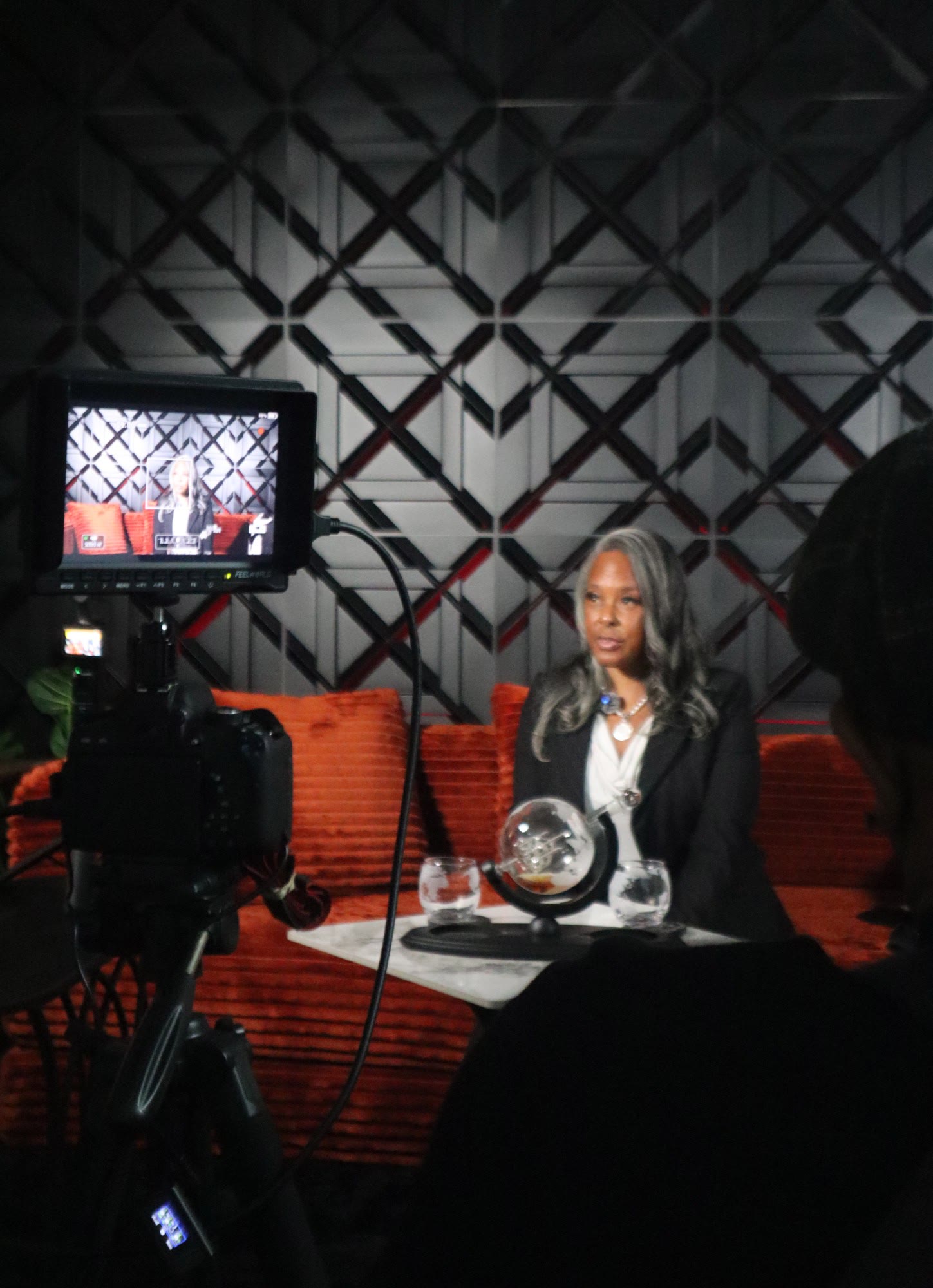 Interview recording on the Elysian set, seen from the camera monitor